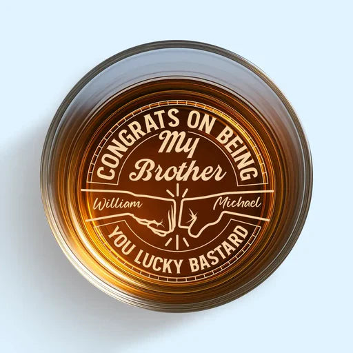 Personalized whiskey glasses with custom engraved congratulatory message for brother with names William and Michael