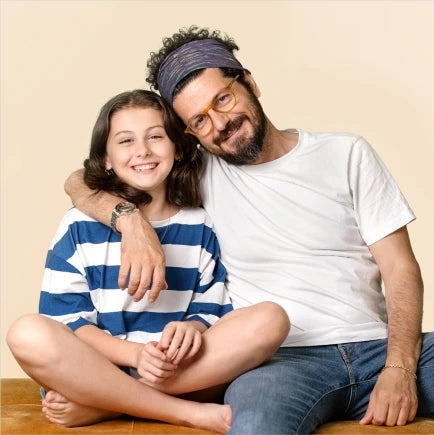 Smiling father and daughter sitting together showing love and joy for personalized gifts for dad