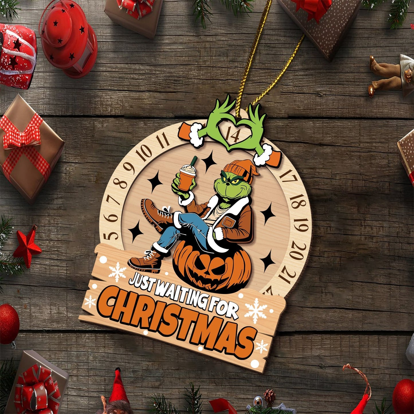3-layered Grinch ornament for Christmas featuring the Grinch sitting on a pumpkin holding a cup with Christmas countdown numbers