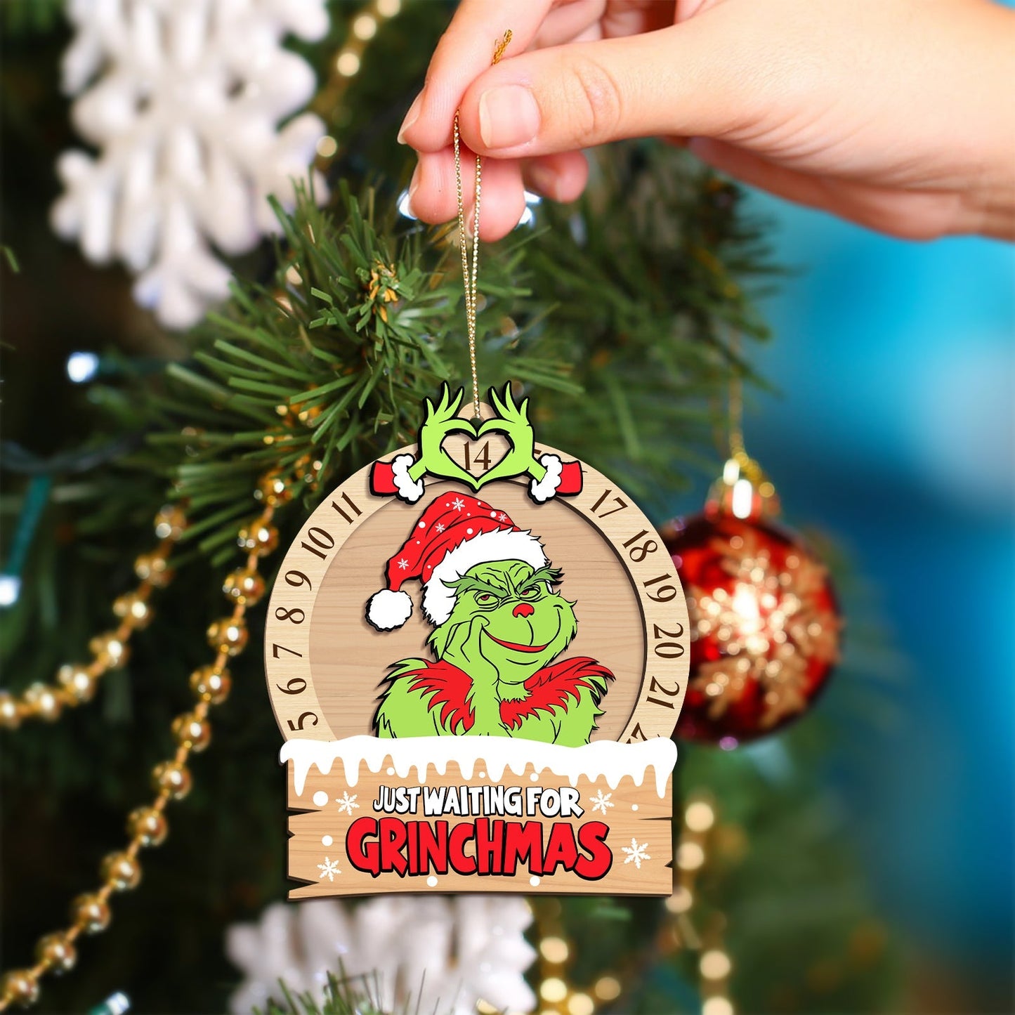 3-layered Grinch ornament for Christmas with Grinch wearing Santa hat and countdown calendar