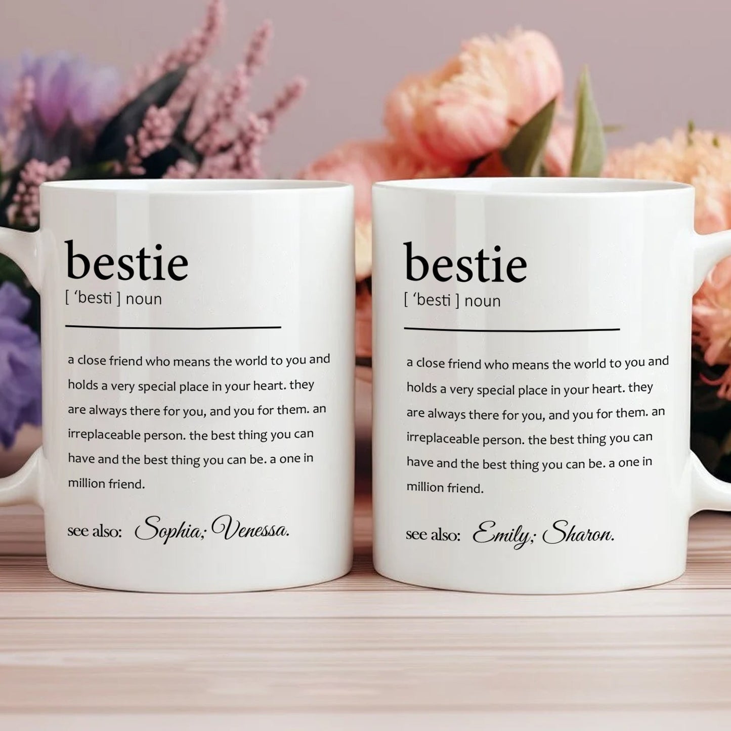 Two white bestie definition mugs with personalized names on desk floral background custom friendship gift for office