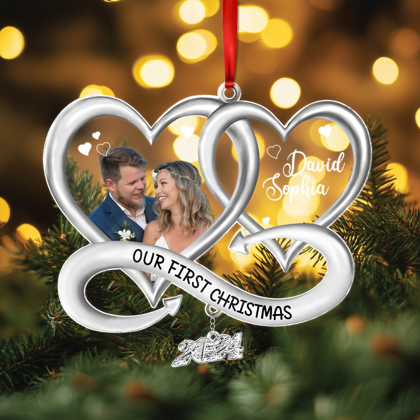 Silver intertwined heart personalized Christmas ornament with photo, names, and Our First Christmas text