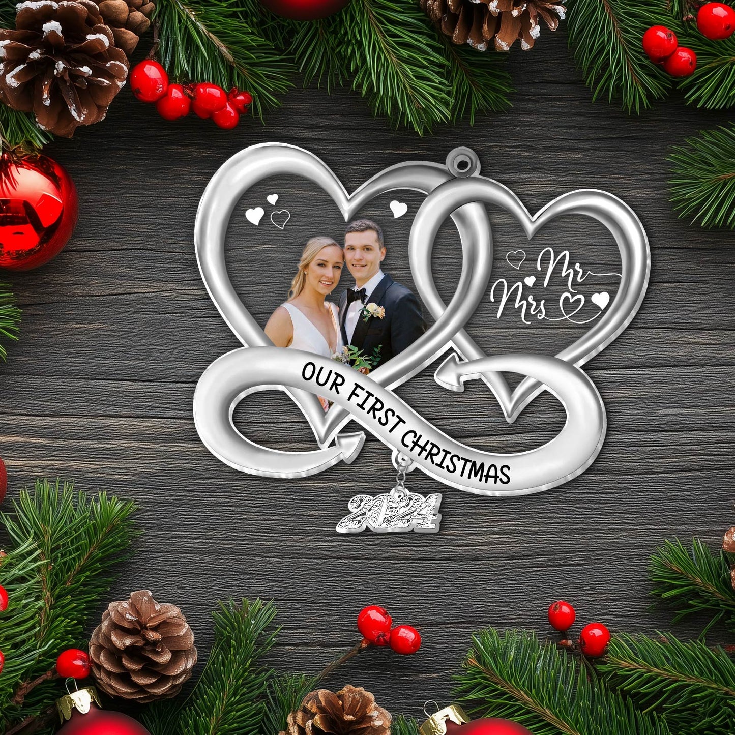 Silver personalized Christmas ornament with intertwined hearts and custom photo of couple celebrating first Christmas