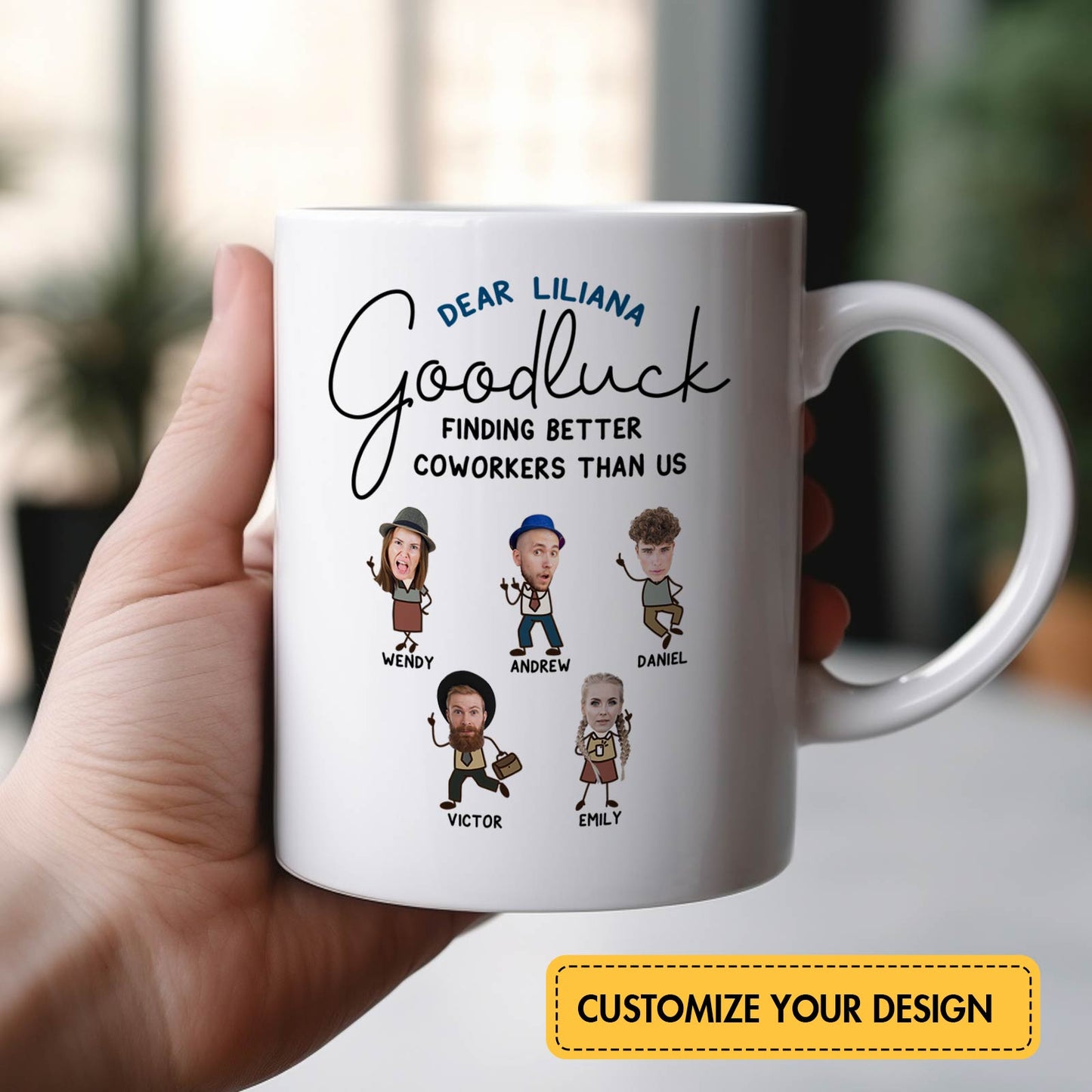 White ceramic personalized coworker mug held in hand with custom caricature faces and names and Goodluck message to Liliana