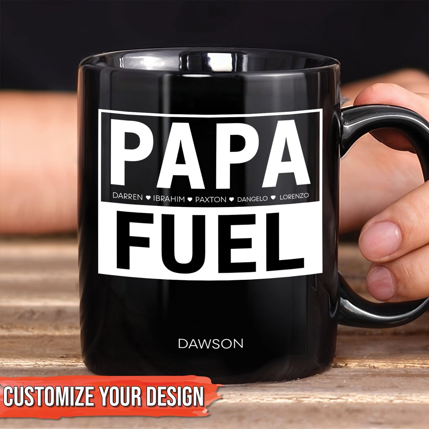Black ceramic personalized dad mug with bold white PAPA FUEL design and custom name Dawson held in hand
