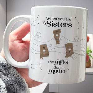 White ceramic mug saying When you are Sisters the miles dont matter with state hearts unique gift for long distance friends