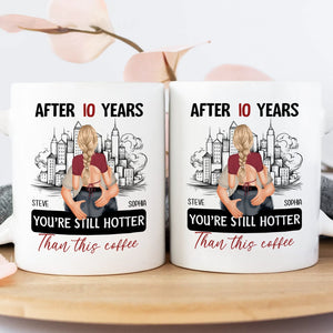 After 10 years still hotter than coffee mug featuring a couple hugging with city skyline background