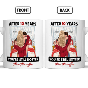 White coffee mug with design showing couple hugging and text after years you're still hotter than this coffee mug