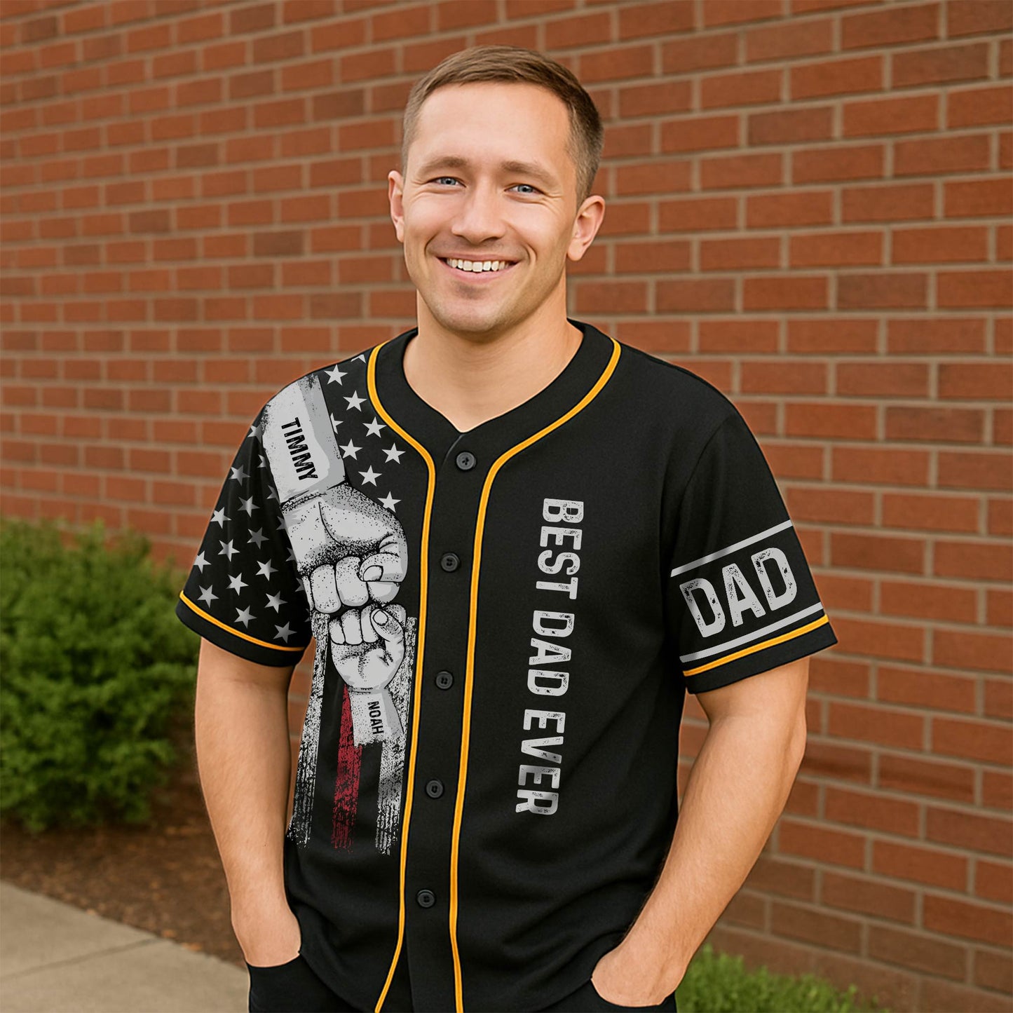 Black best dad ever Hawaiian shirt with fist bump design and yellow trim worn by smiling man