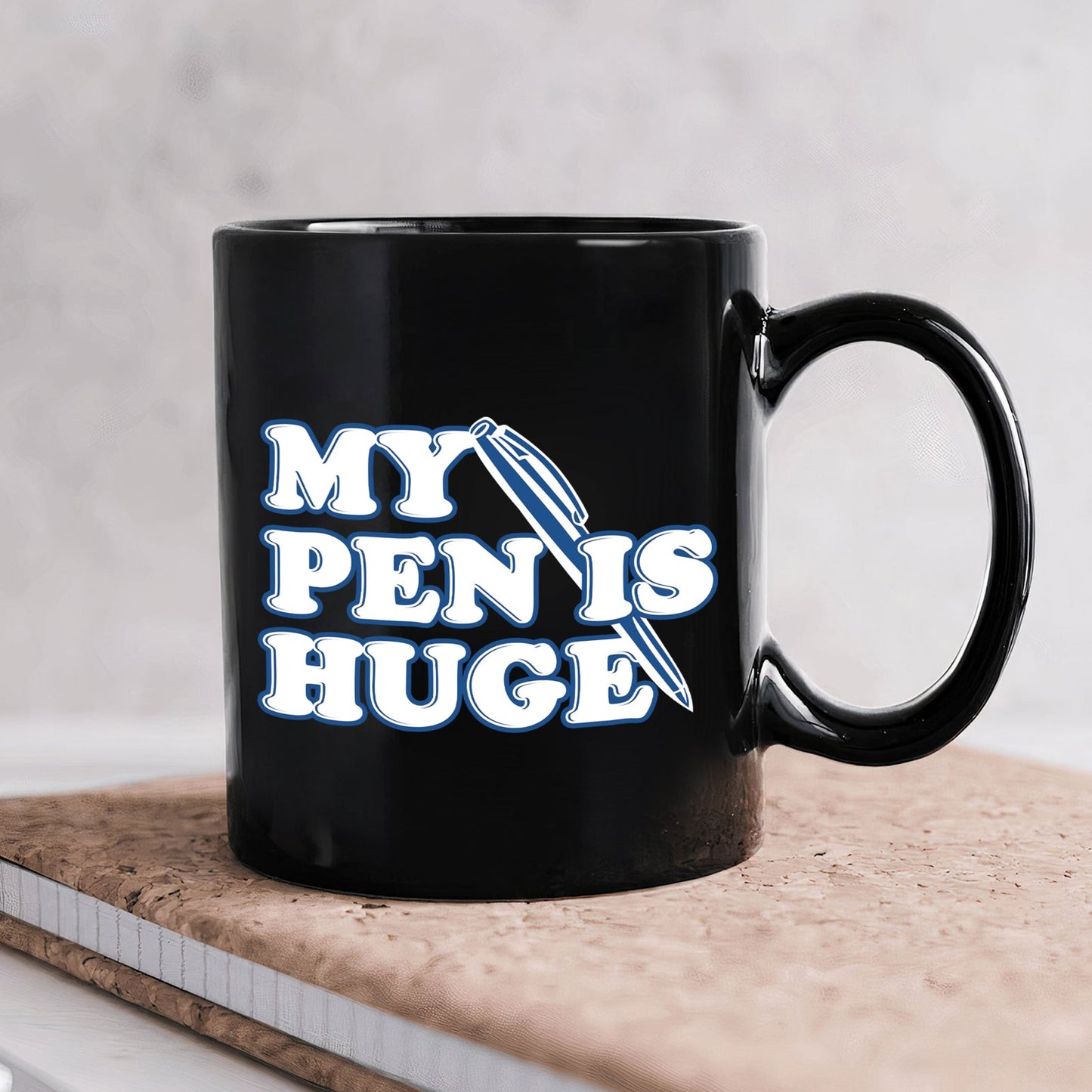 Black ceramic 11oz my pen is huge coffee mug with bold white and blue typography and pen graphic