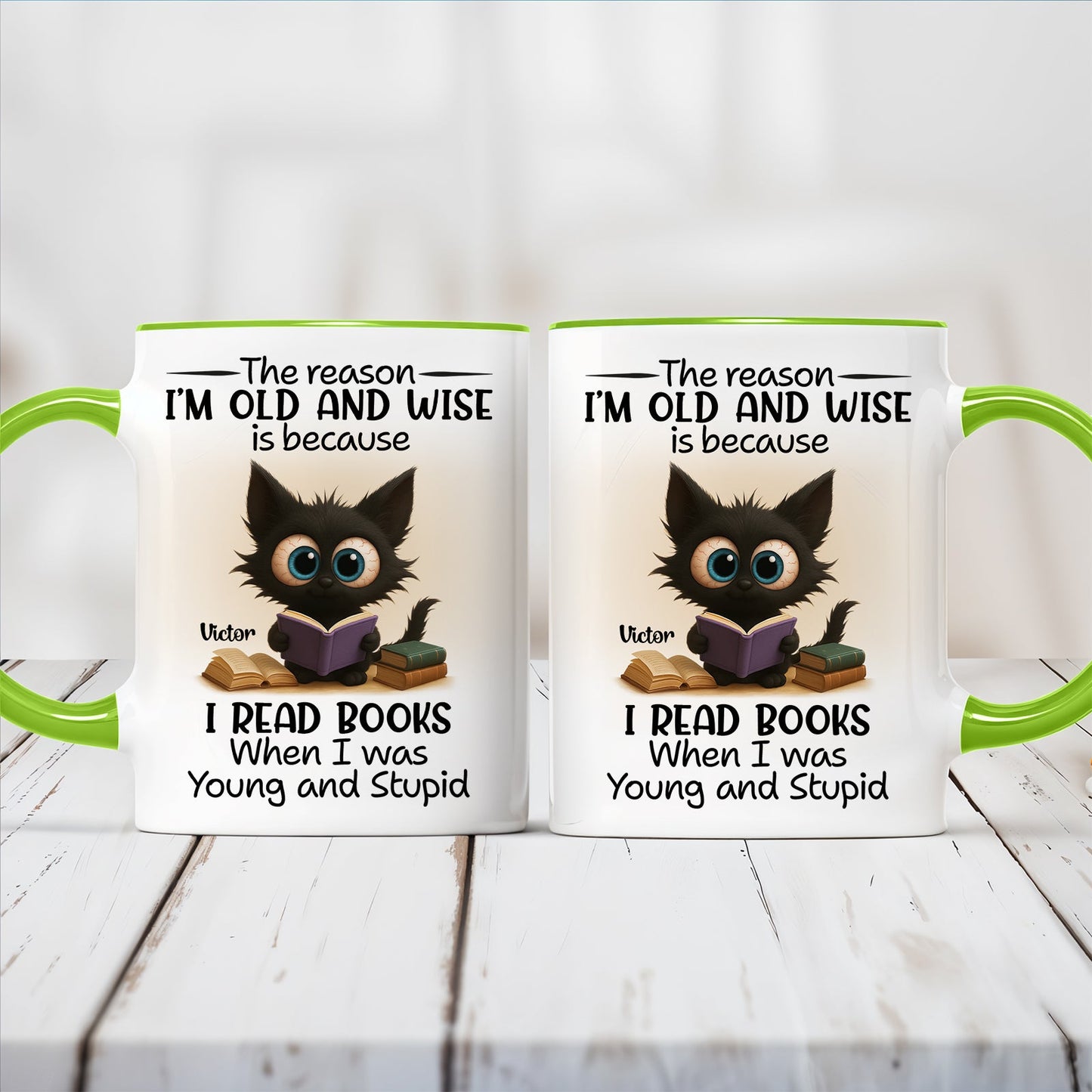 Two 365Gifty white mugs with green handles showing a wide eyed cat reading books and funny personalized accent mug for bookworms