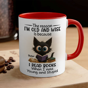 Red rim ceramic mug with wide eyed black cat reading books and quote name Victor funny personalized accent mug for bookworms