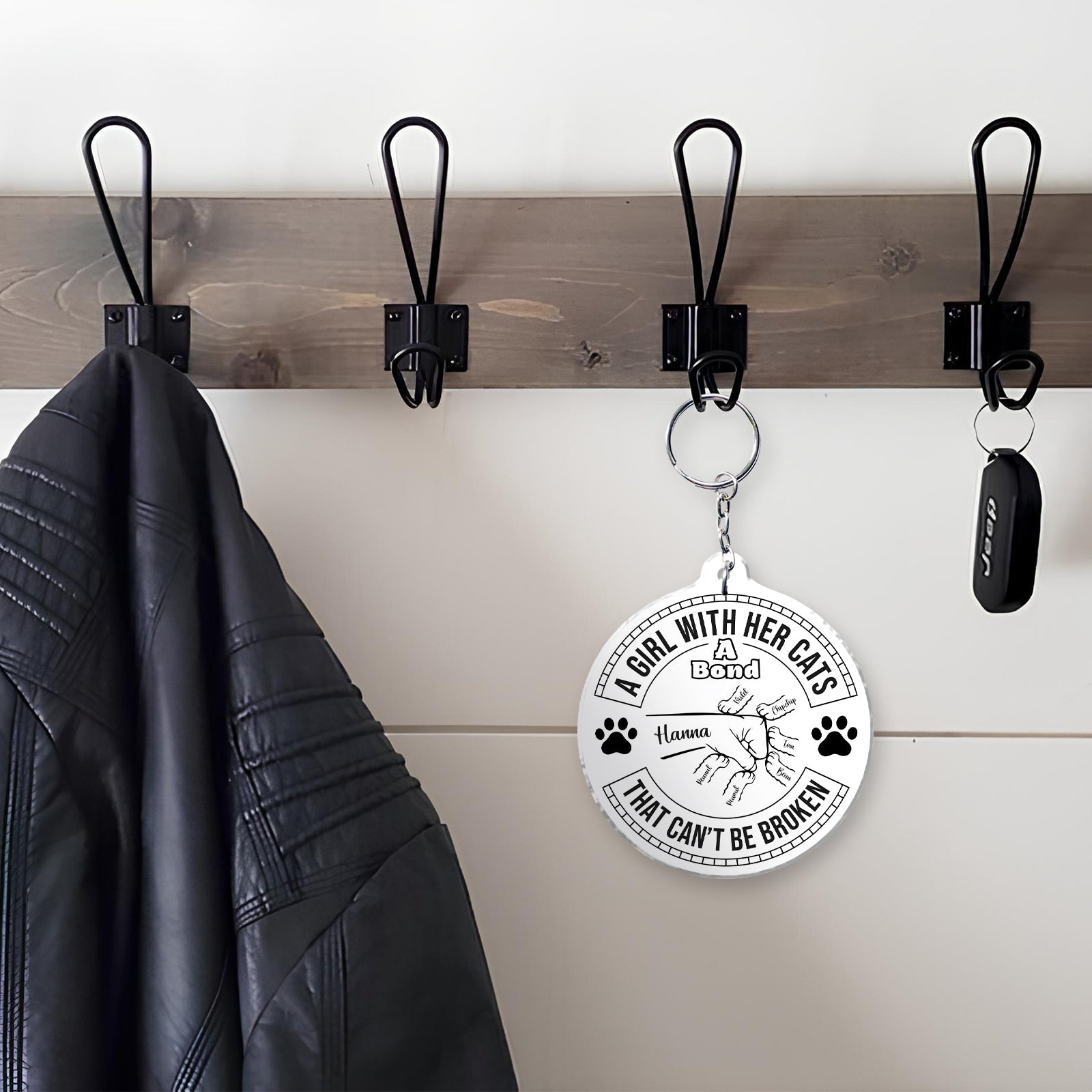 Cat lover keychain featuring a design that celebrates the bond between a girl and her cats