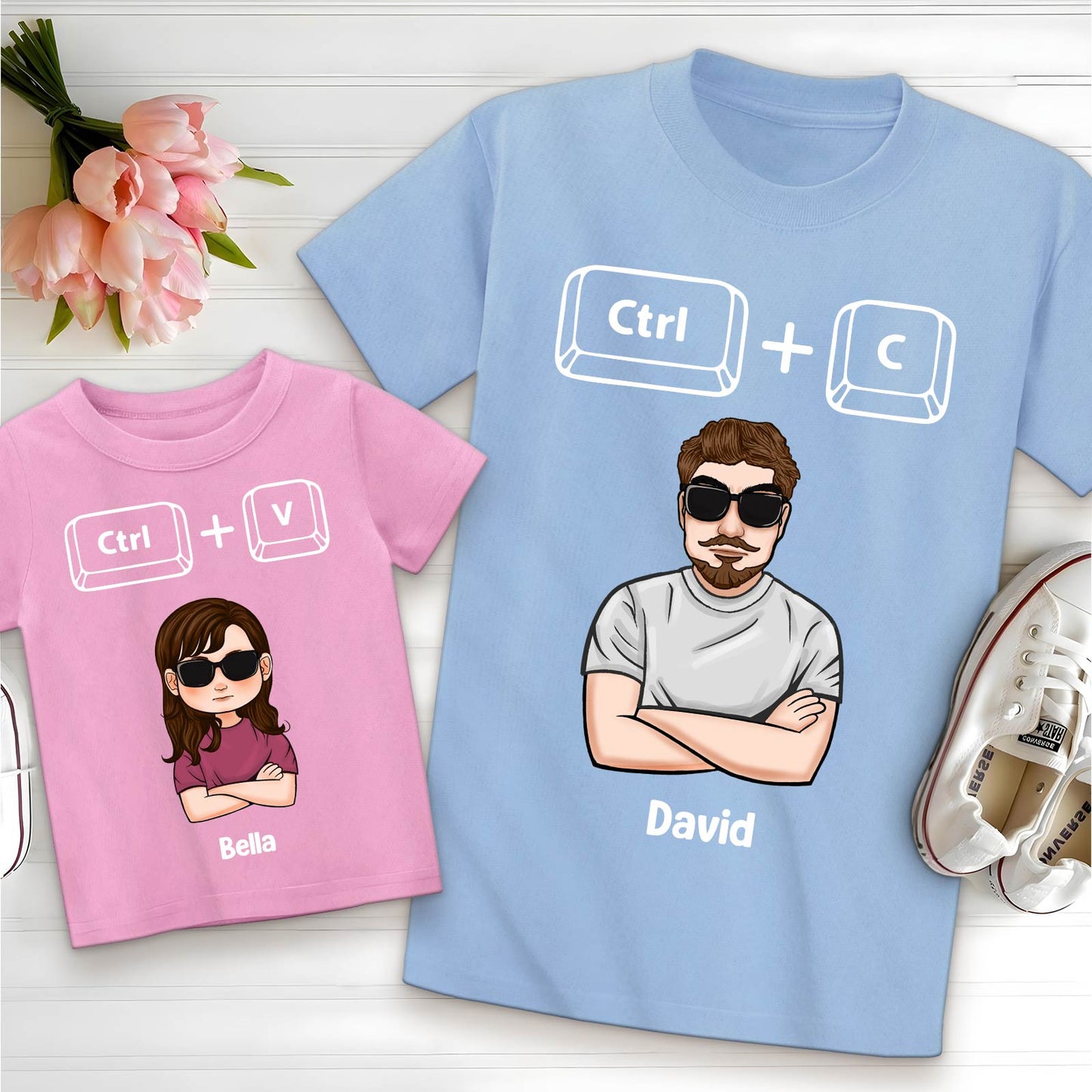 Blue and pink copy paste shirts for dad and baby with cartoon characters and Ctrl C and Ctrl V keys
