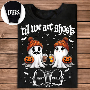 Black personalized Halloween couple shirt with two cute ghosts in orange beanies holding pumpkins and coffee cups