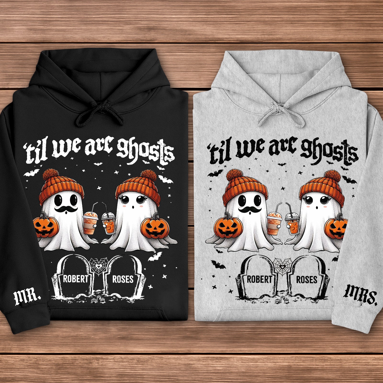 Black and gray hoodies personalized Halloween couple shirt featuring two cute ghosts in orange beanies holding pumpkins and drinks