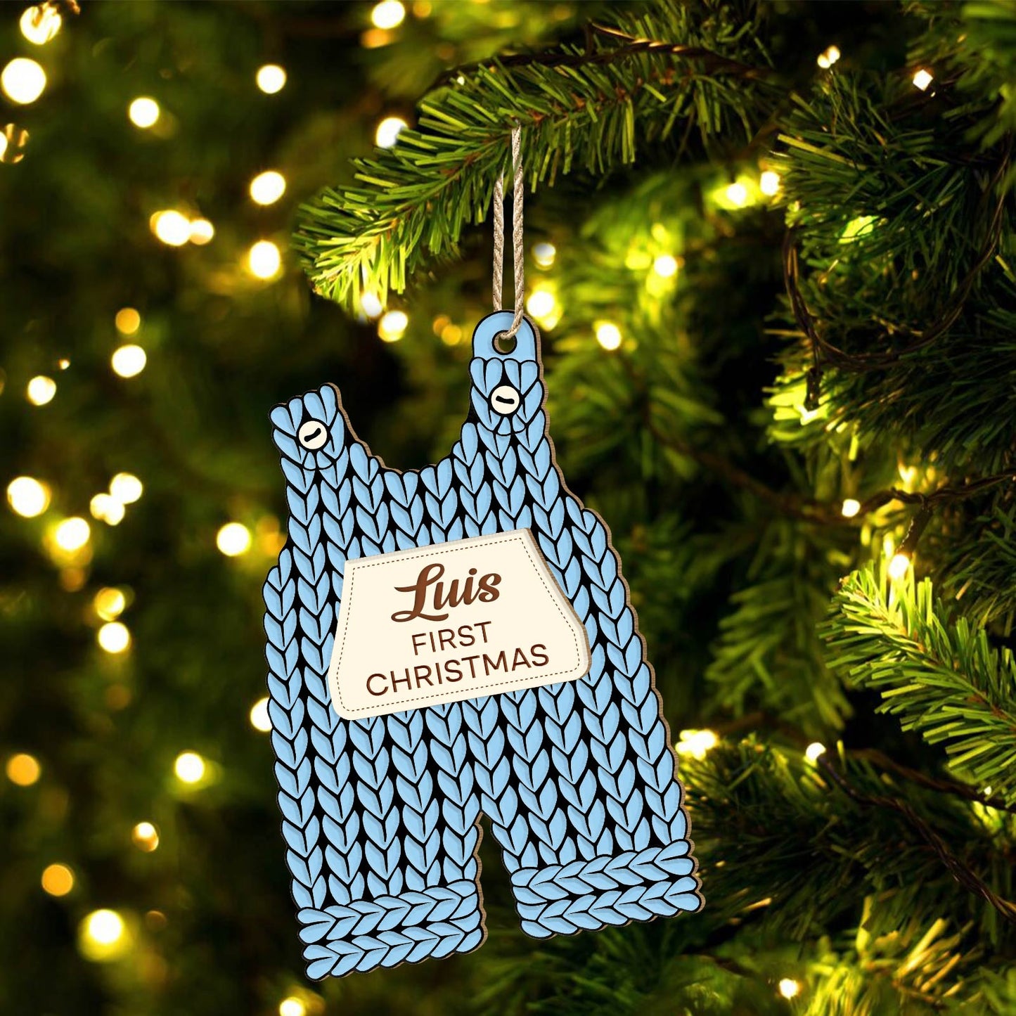 Custom 2-layered Christmas ornament for baby shaped like blue knitted overalls with name and first Christmas text