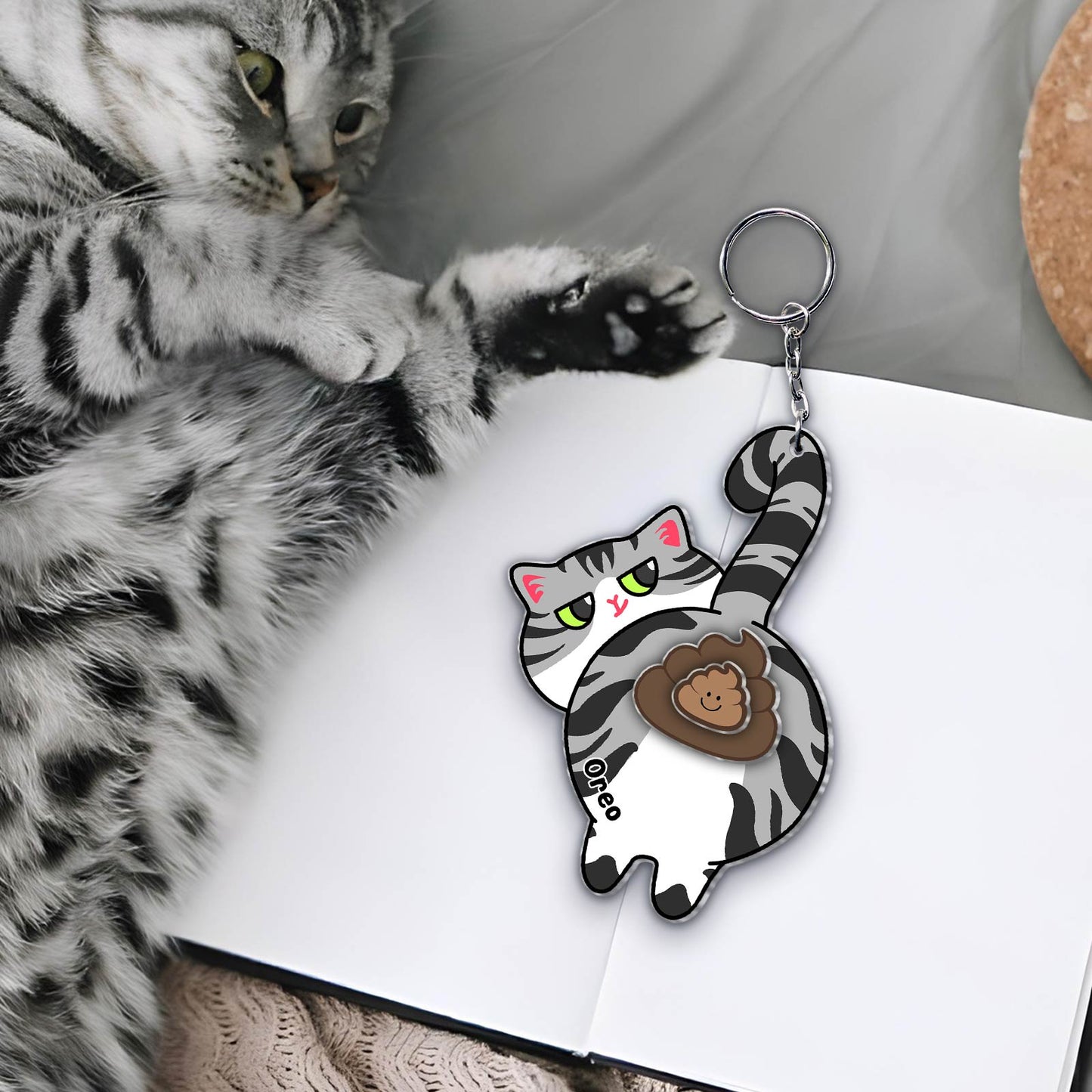 Custom acrylic cat keychain featuring a cute playful cat design for pet lovers
