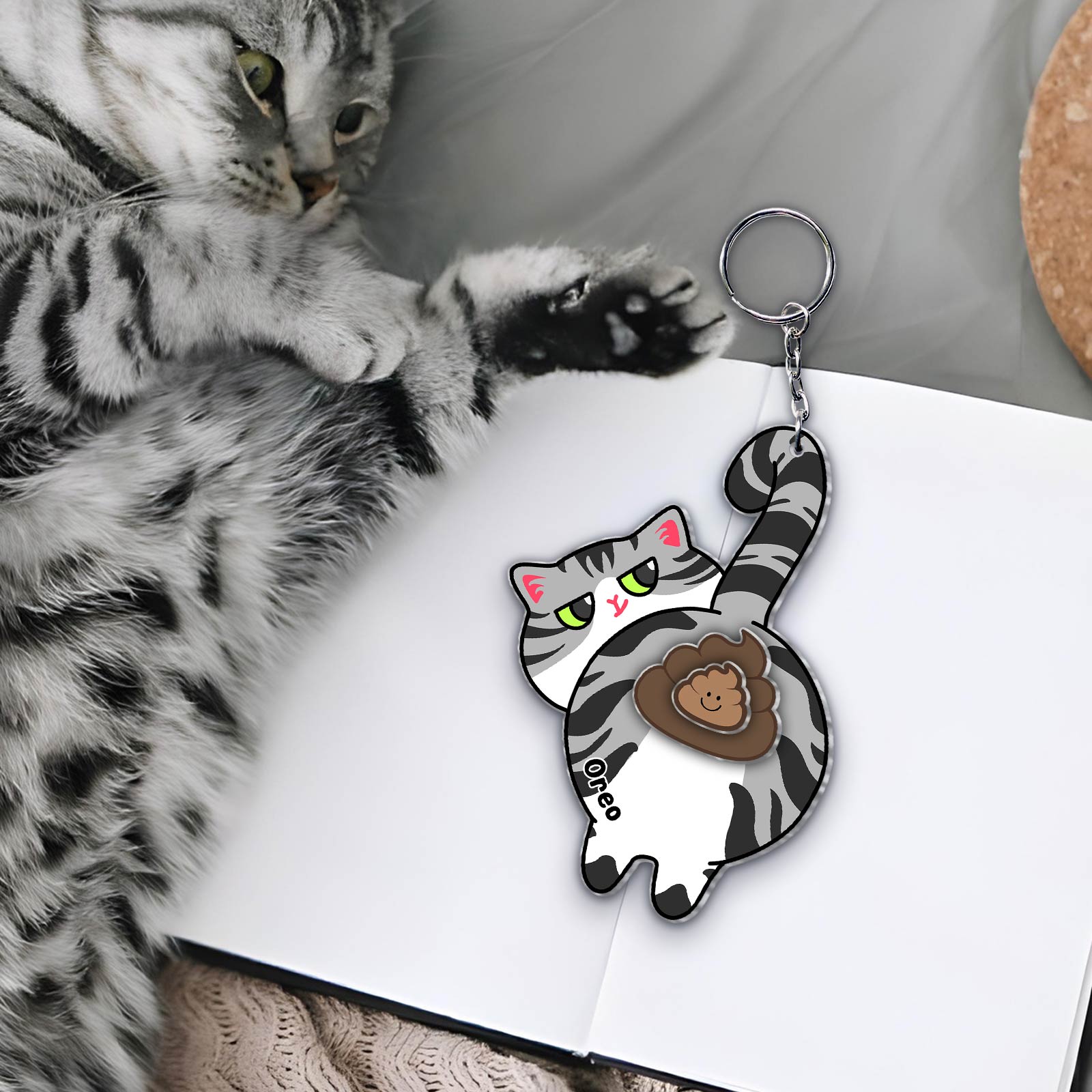 Custom acrylic cat keychain featuring a cute playful cat design for pet lovers
