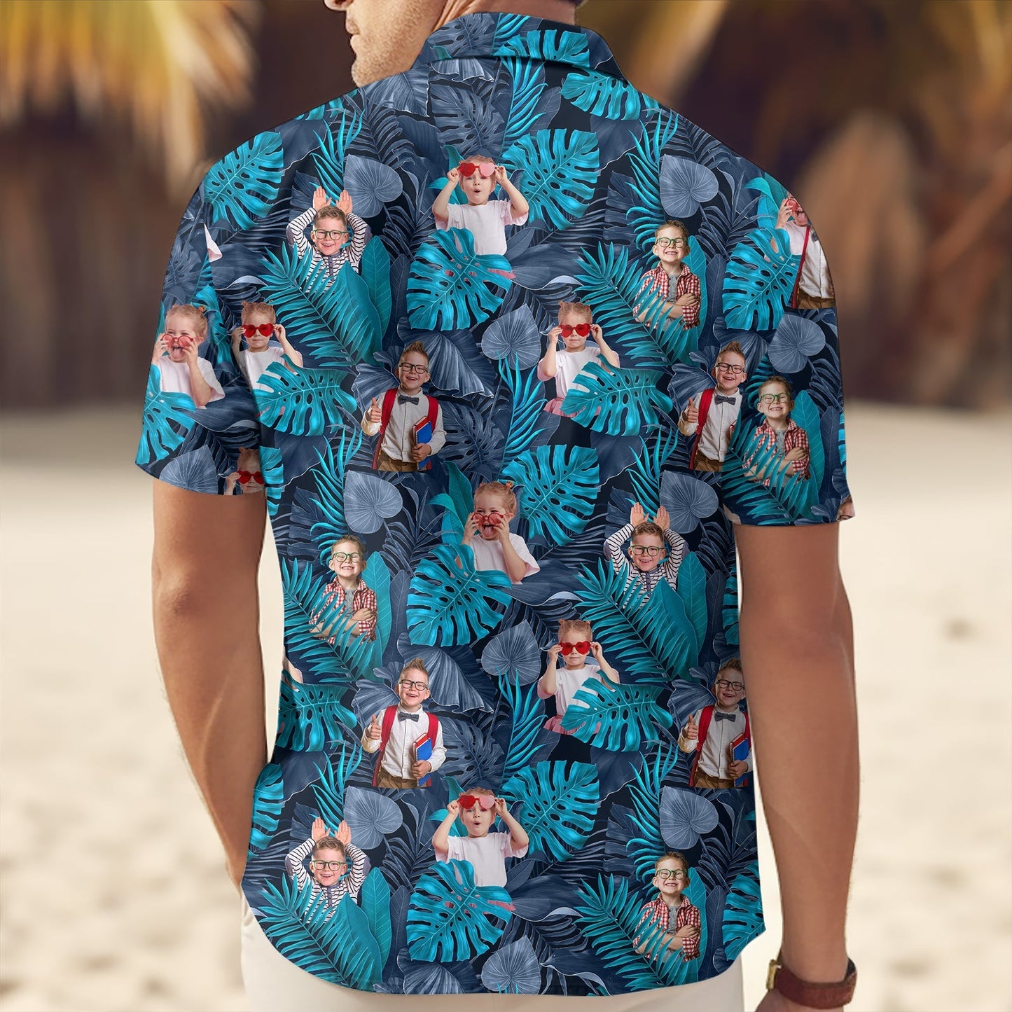 Custom blue tropical linen shirt with vibrant leaf pattern and personalized photo design on beach