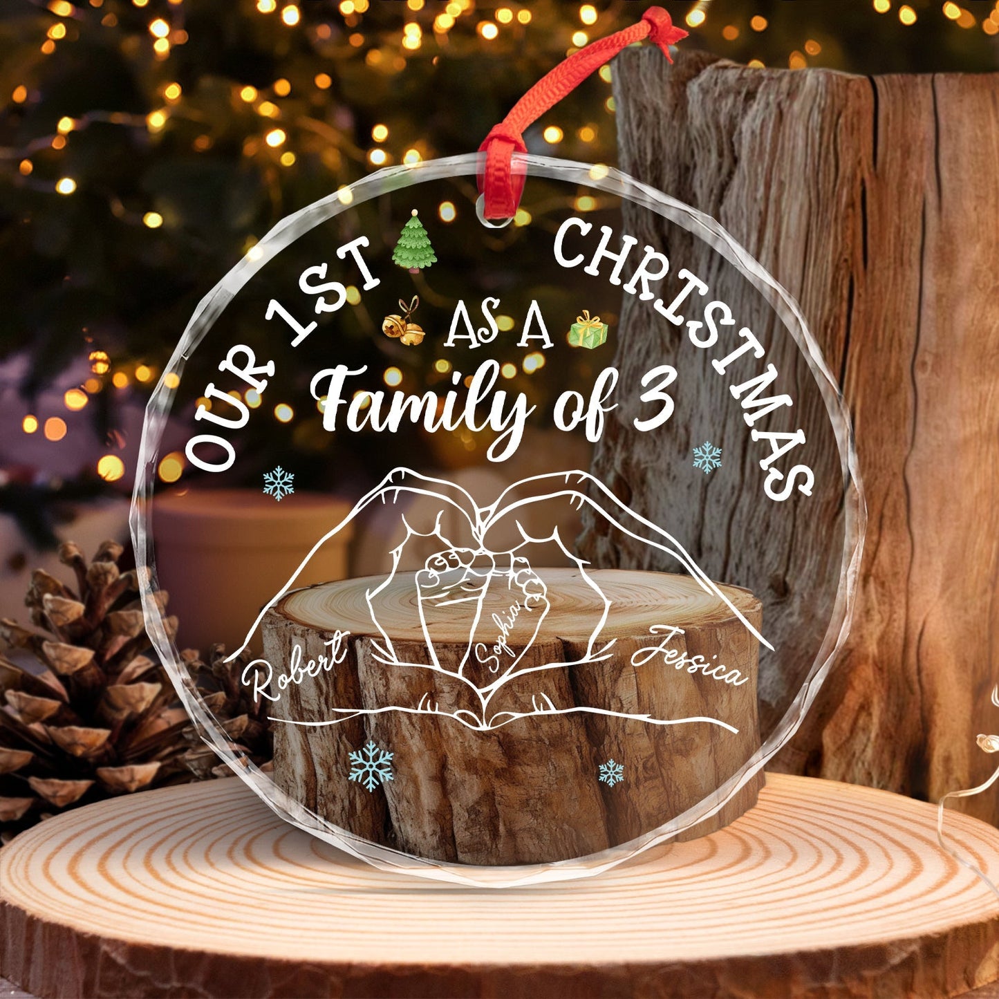 Custom family Christmas glass ornament with names and family of 3 text hanging on wood background