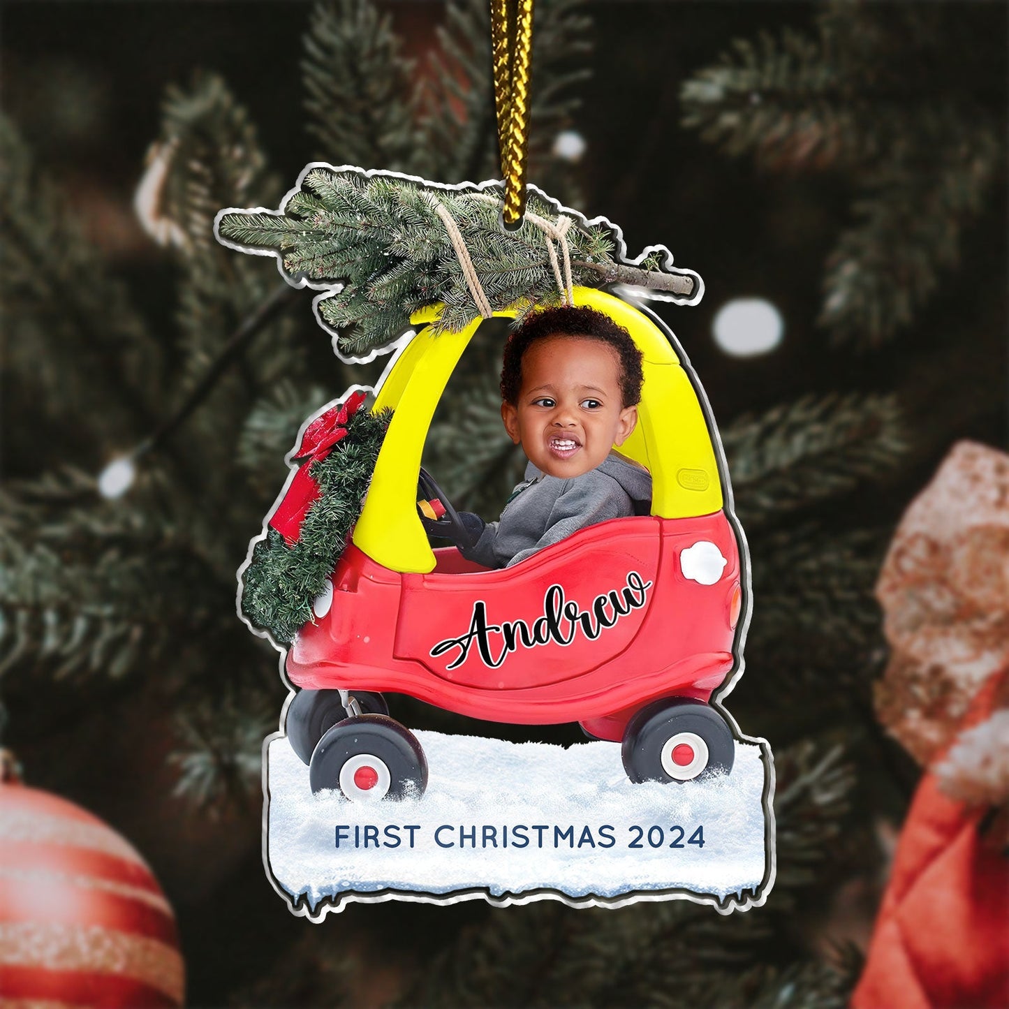Custom first Christmas acrylic ornament featuring a child named Andrew in a red and yellow car with a Christmas tree on top