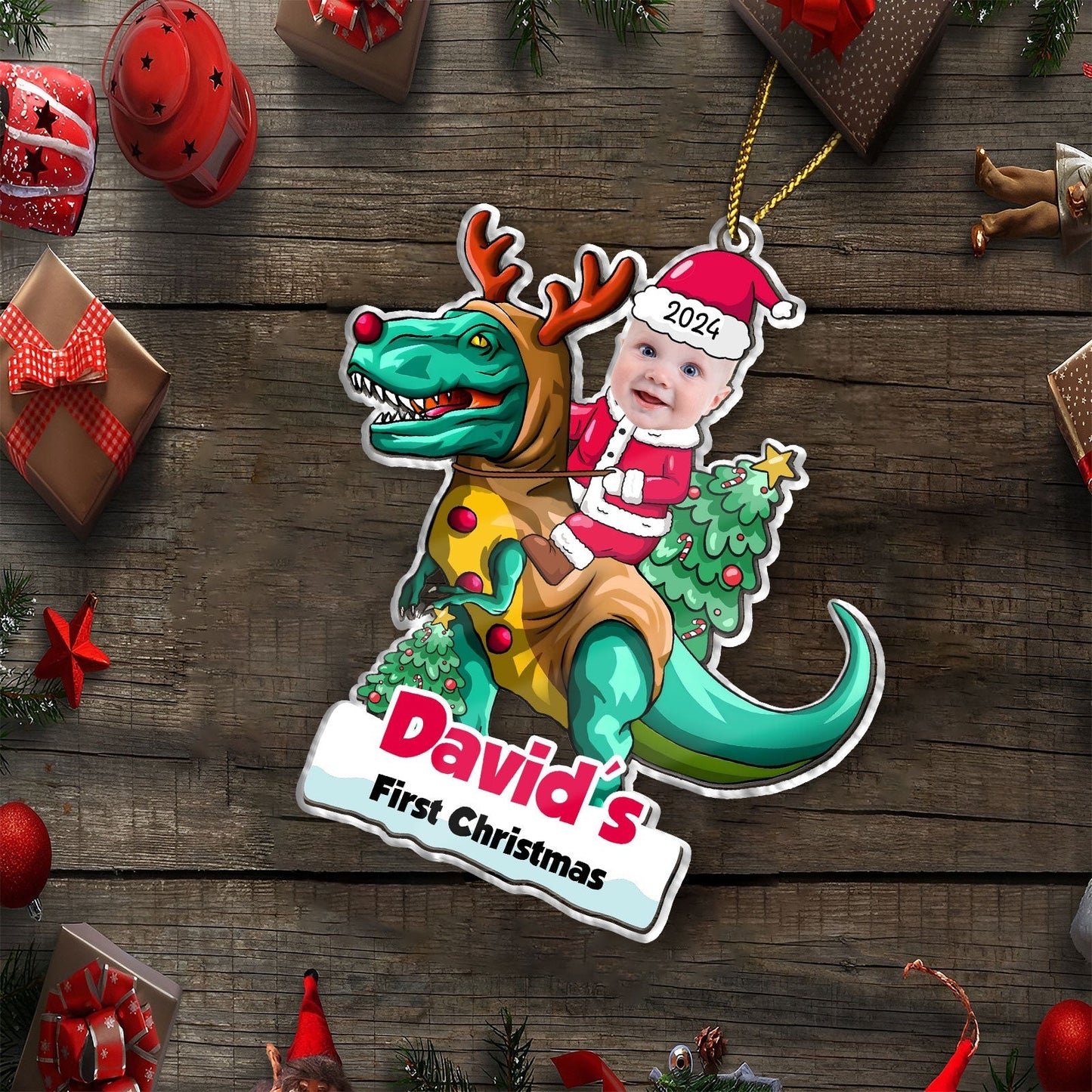 Custom first Christmas baby ornament featuring a baby in Santa outfit riding a reindeer dinosaur