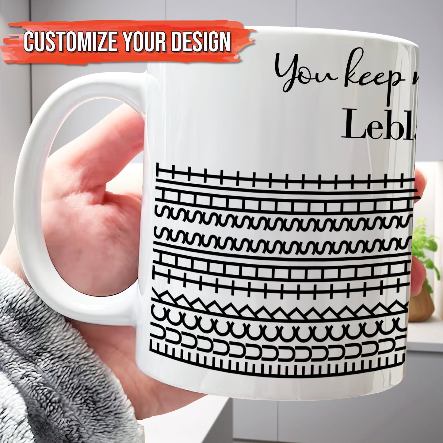 Hand holding 365Gifty white ceramic personalized 'You Keep Me Sane' mug with black geometric stripe pattern