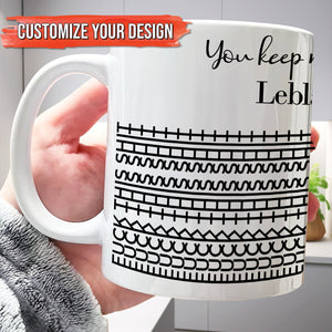 Hand holding 365Gifty white ceramic personalized 'You Keep Me Sane' mug with black geometric stripe pattern