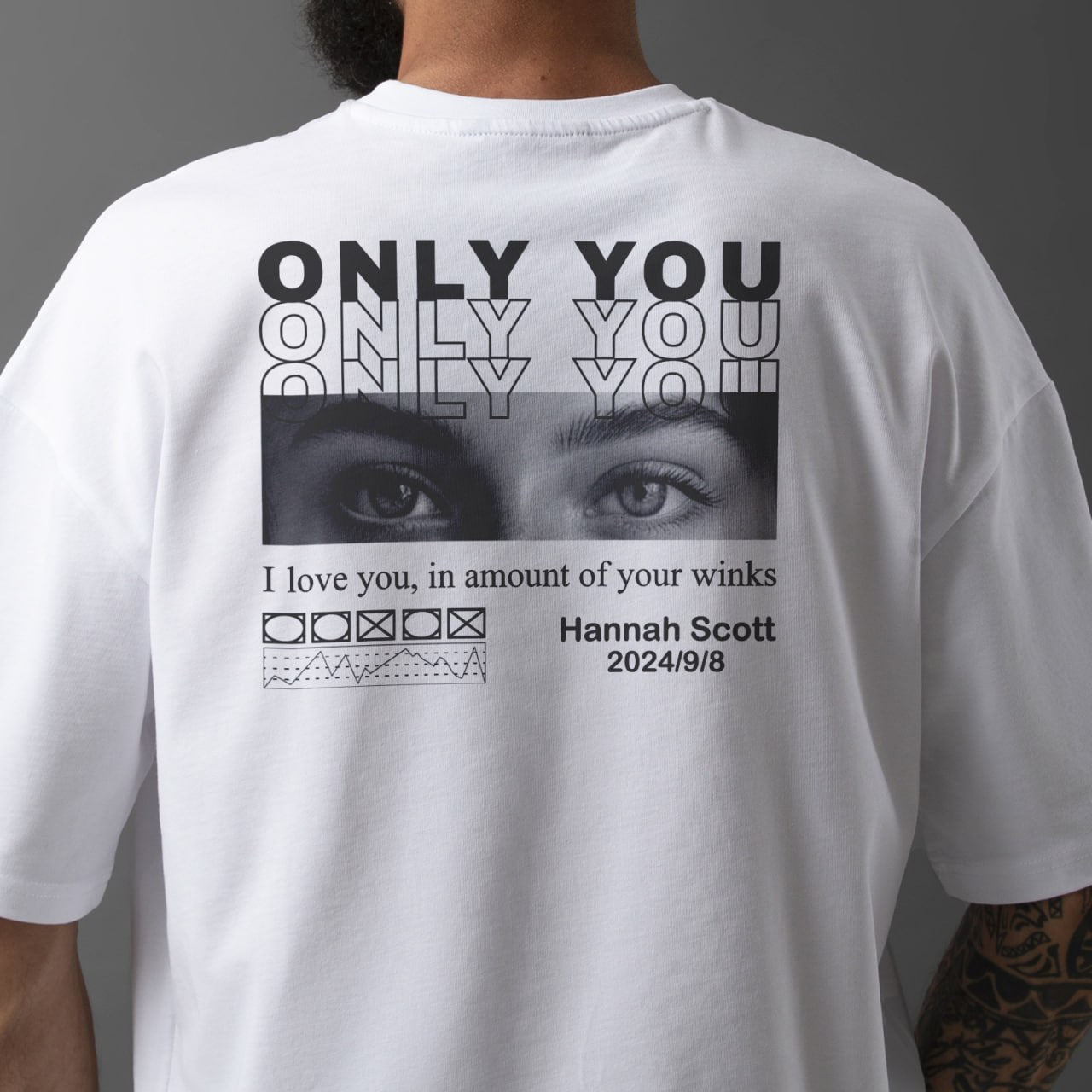 White custom only you shirt with black graphic eyes and personalized text on the back