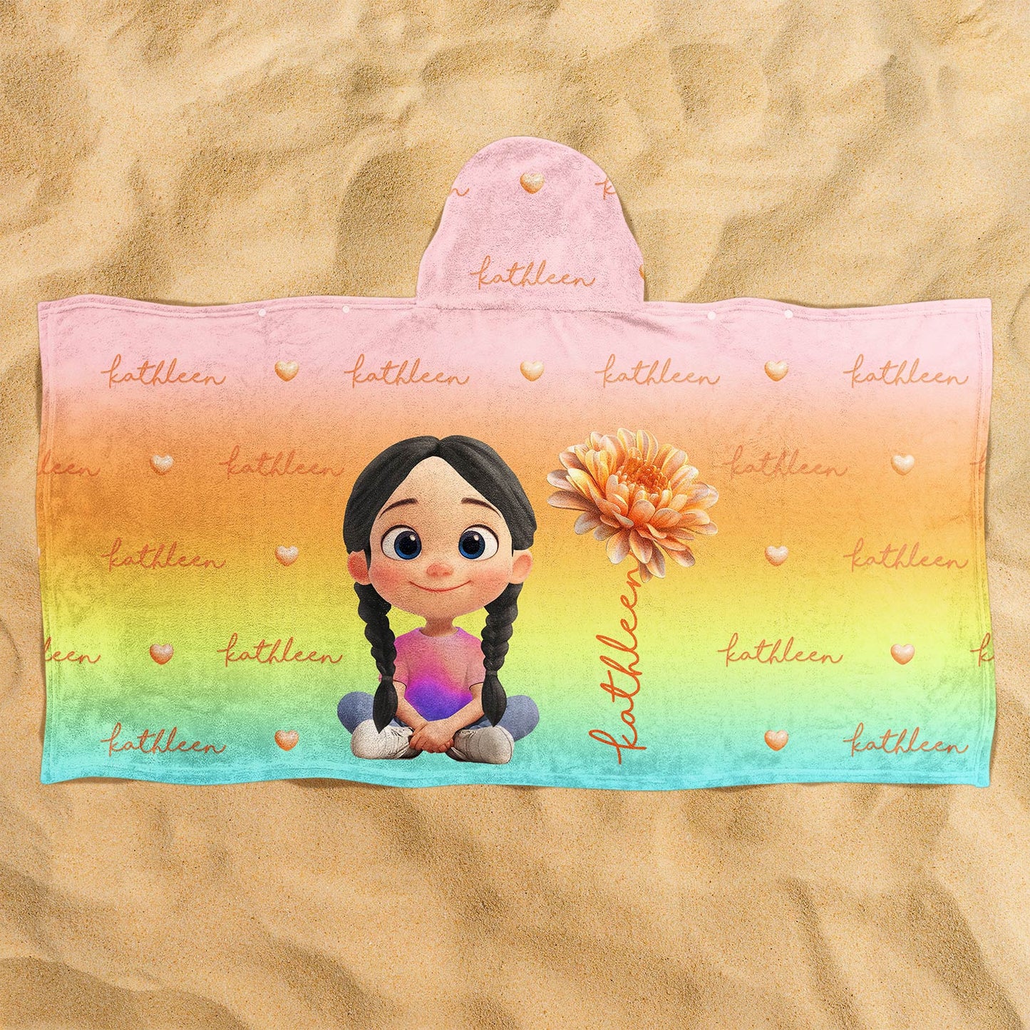 Personalized Beach Towel hooded rainbow towel with cartoon girl with braids holding a flower and the name Kathleen on sand