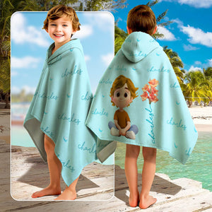 Personalized Beach Towel hooded light blue kids towel with repeated name script and cartoon boy design at beach