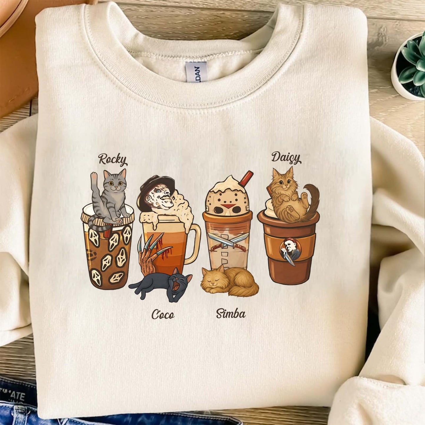 Cream personalized halloween cat shirt featuring four cats with Halloween-themed drinks and names Rocky Coco Simba Daisy