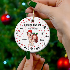 personalized couple ornament white ceramic with cartoon couple in Santa hats names James and Luna held by hand