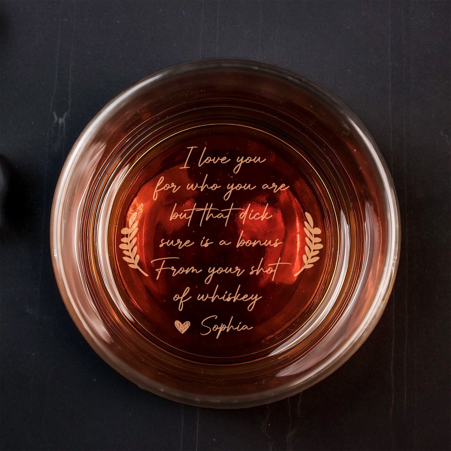 Top view of 365Gifty Personalized Whiskey Glass with amber whiskey and engraved romantic message at base
