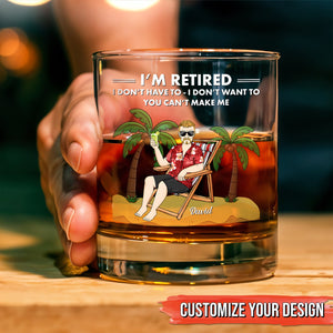 Personalized Whiskey Glass with retired tropical design showing a man in a Hawaiian shirt reclining with a custom name