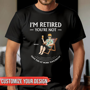 Black personalized retirement t-shirt with I'm Retired You're Not text and cartoon man relaxing
