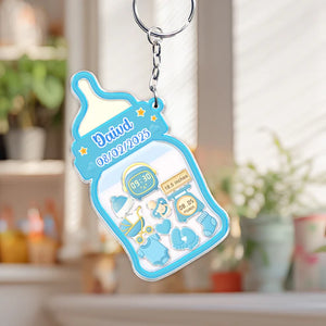 Family keepsake baby announcement keychain in blue featuring a baby bottle design with birth details