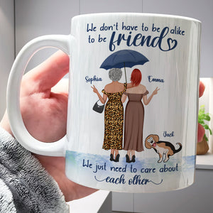 365Gifty white ceramic we just need to care about each other mug with two women under umbrella and a dog