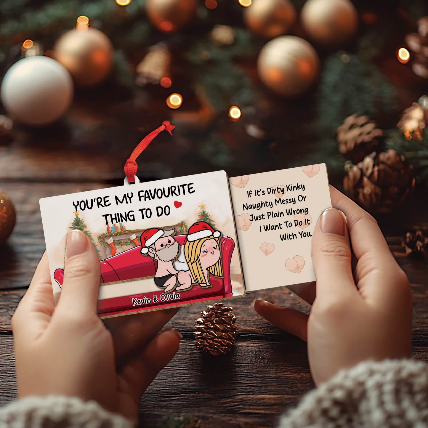 Personalized couple ornament with cute cartoon design and customizable names Kevin and Olivia hanging on Christmas tree