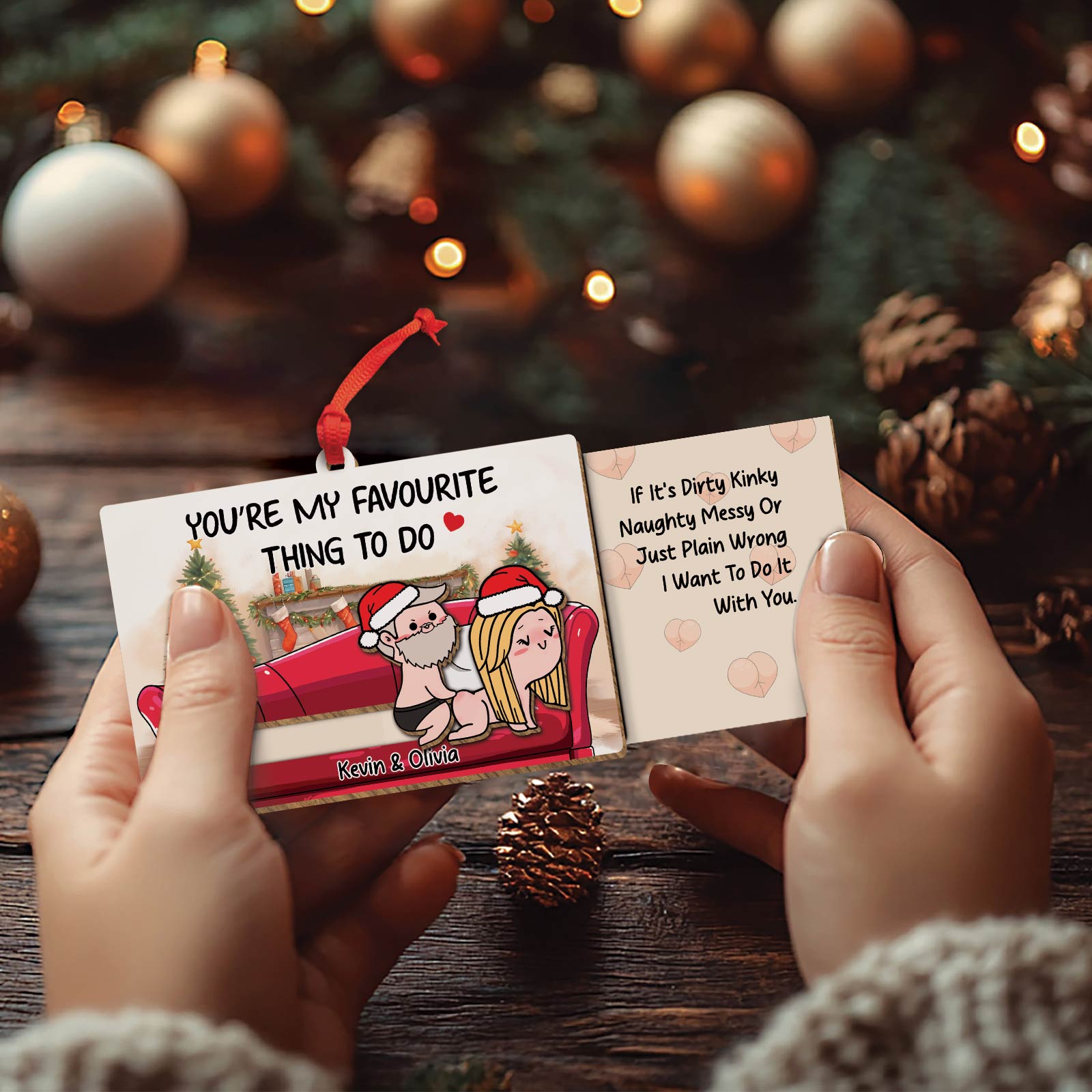 Personalized couple ornament with cute cartoon design and customizable names Kevin and Olivia hanging on Christmas tree