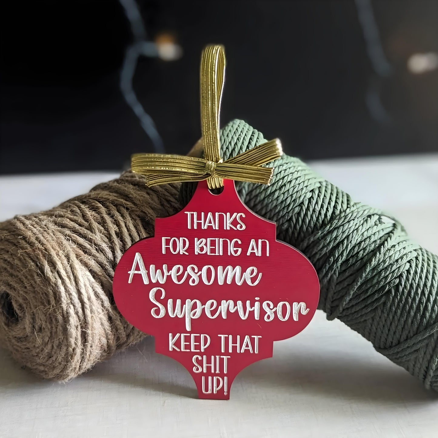 Funny Christmas wooden ornament in red with gold ribbon saying thanks for being an awesome supervisor