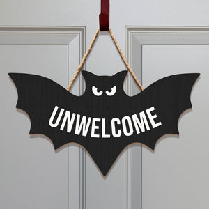 Funny Halloween door sign shaped like a bat with the word UNWELCOME for spooky decorations