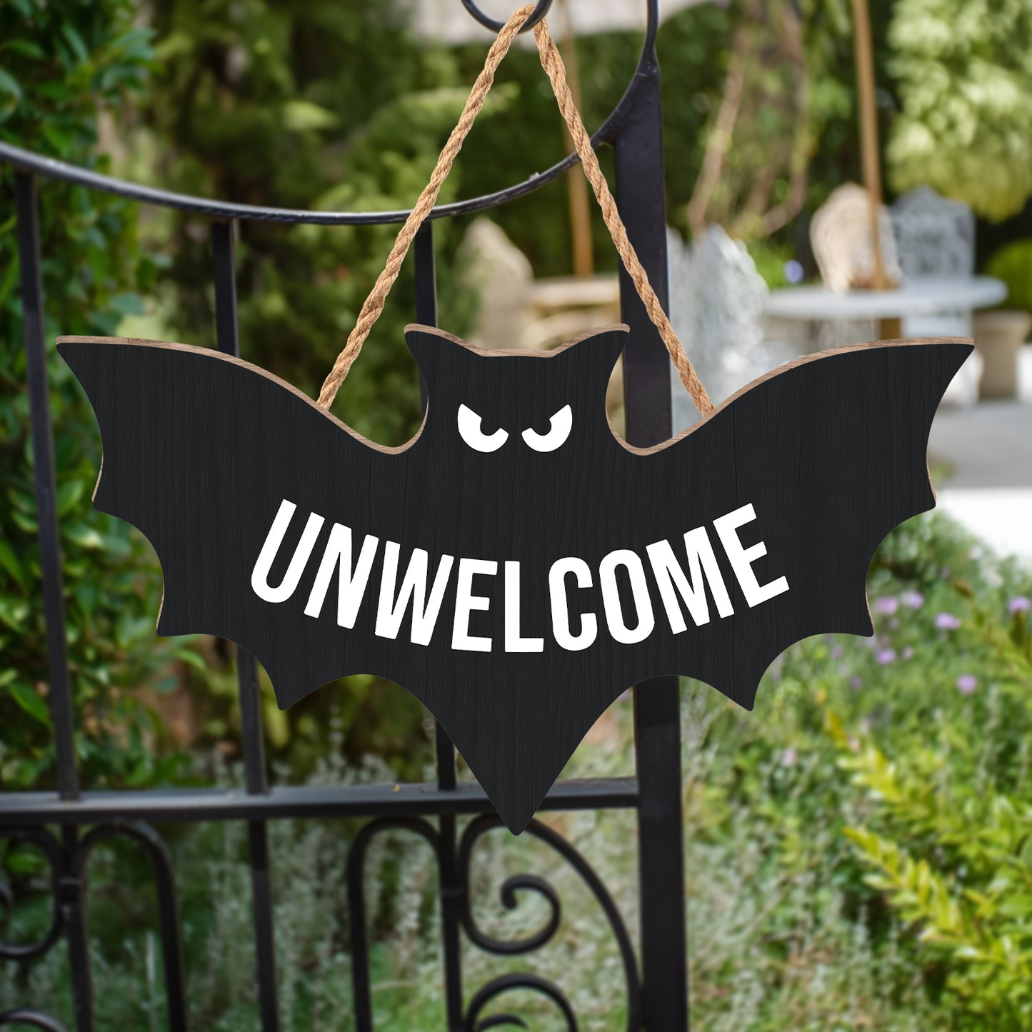 Funny Halloween door sign featuring a bat with the word UNWELCOME for a spooky decoration