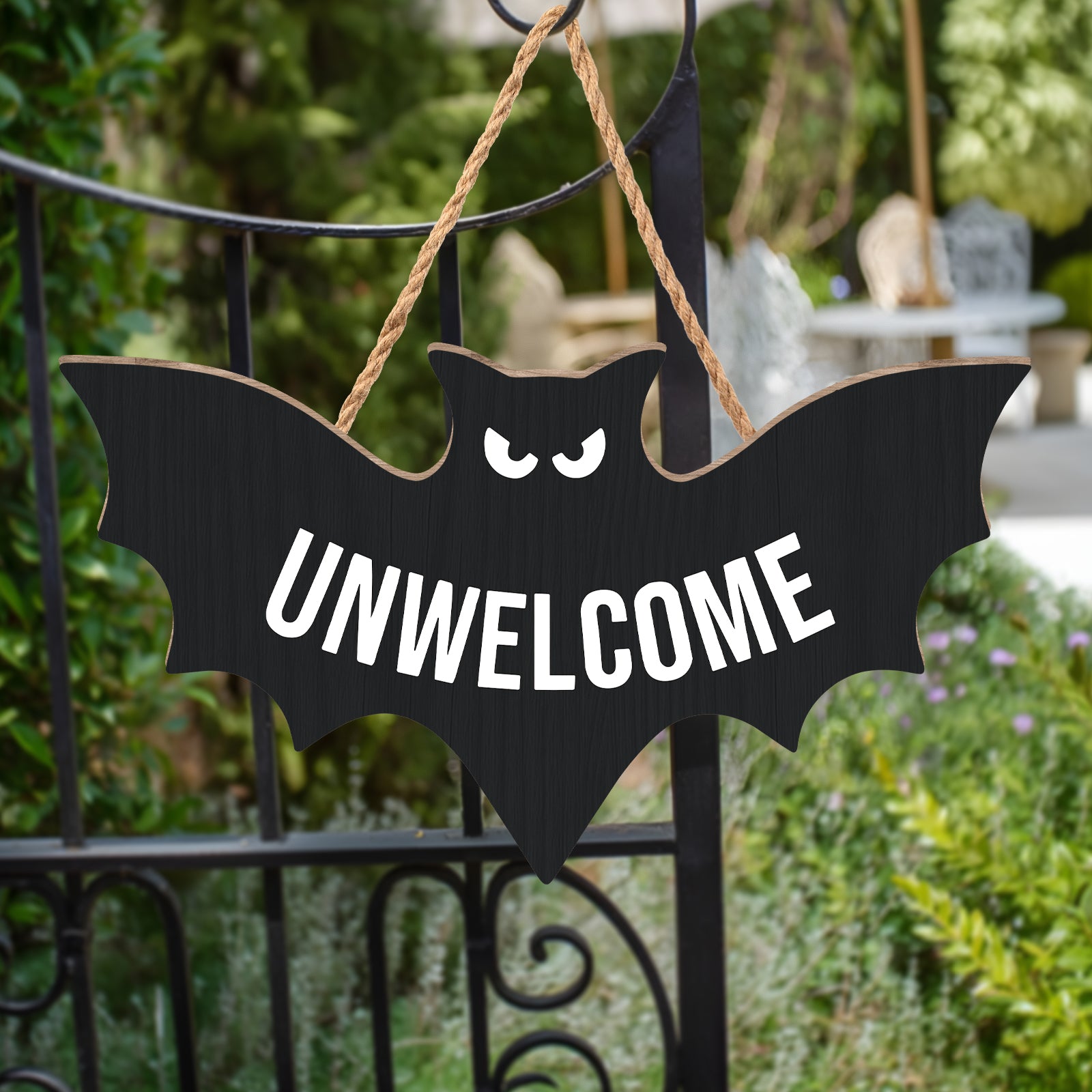 Funny Halloween door sign featuring a bat with the word UNWELCOME for a spooky decoration