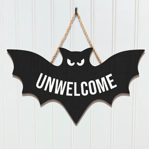Funny Halloween door sign in the shape of a bat with the word UNWELCOME in bold letters