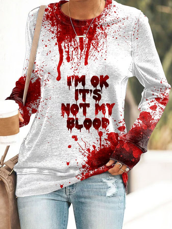 Halloween shirt with blood splatter design and text I'm ok it's not my blood in red on white long sleeve