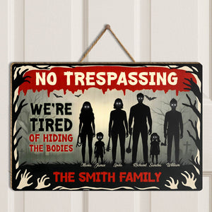 Halloween Wooden Door Sign with spooky family silhouette and humorous trespassing message