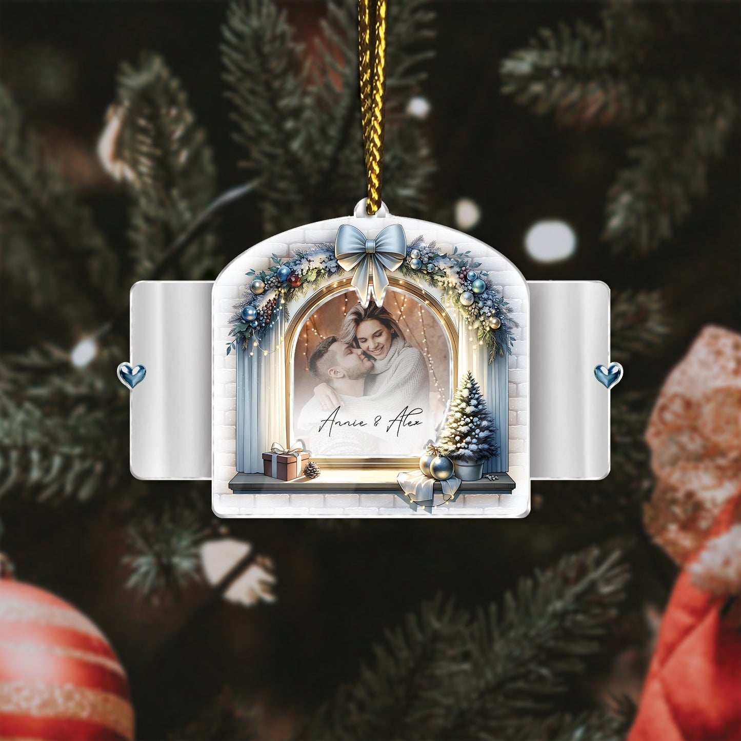 Personalized first Christmas ornament for couples with a photo frame, blue bow, and festive winter decorations