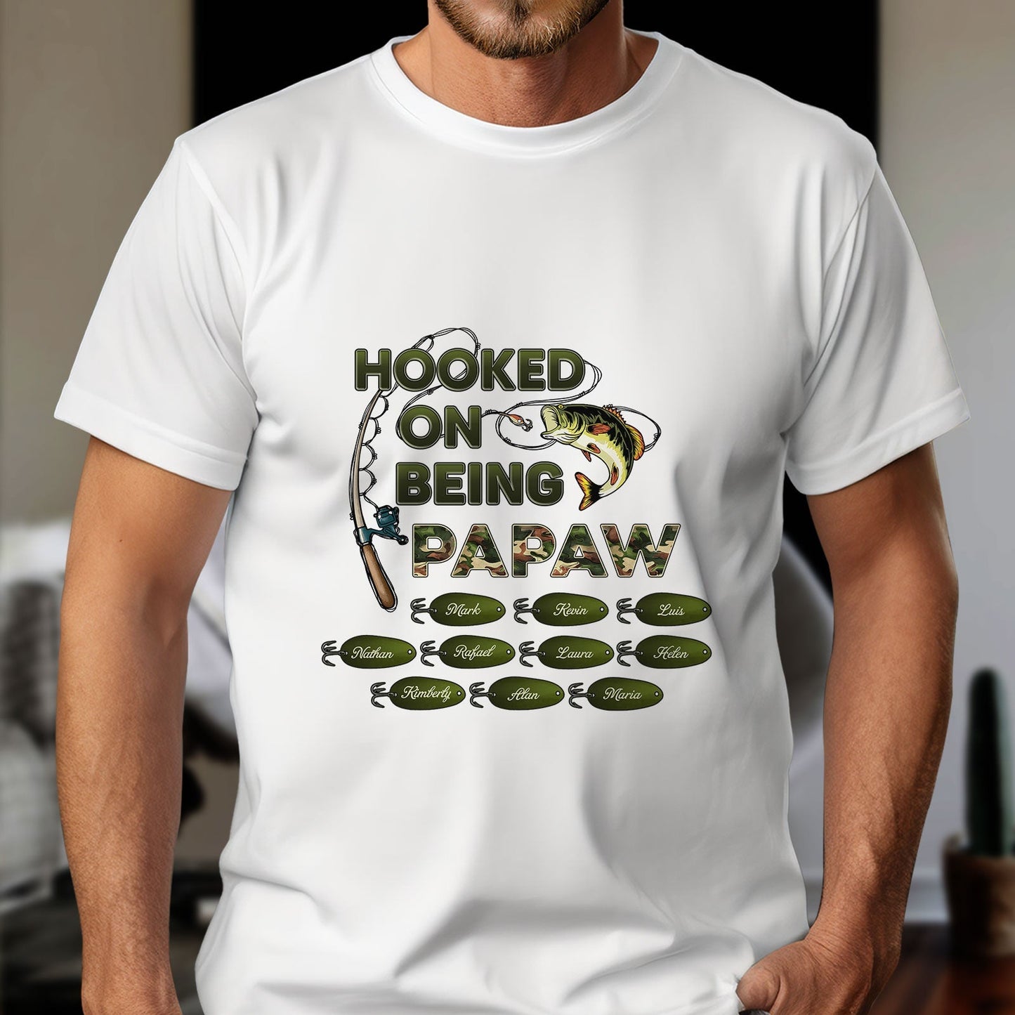 White shirt with fishing design and hooked on being grandpa shirt text featuring fish and fishing rod